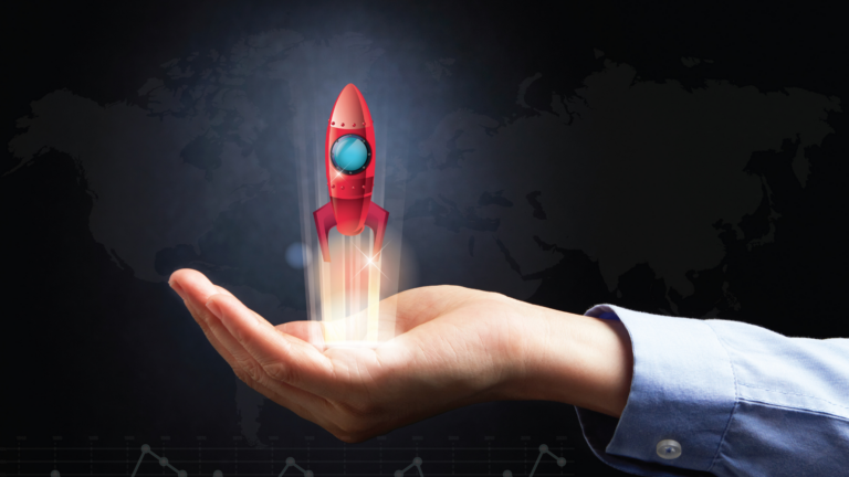 Image of a small red rocket blasting out of someone's palm to showcase a product launch.